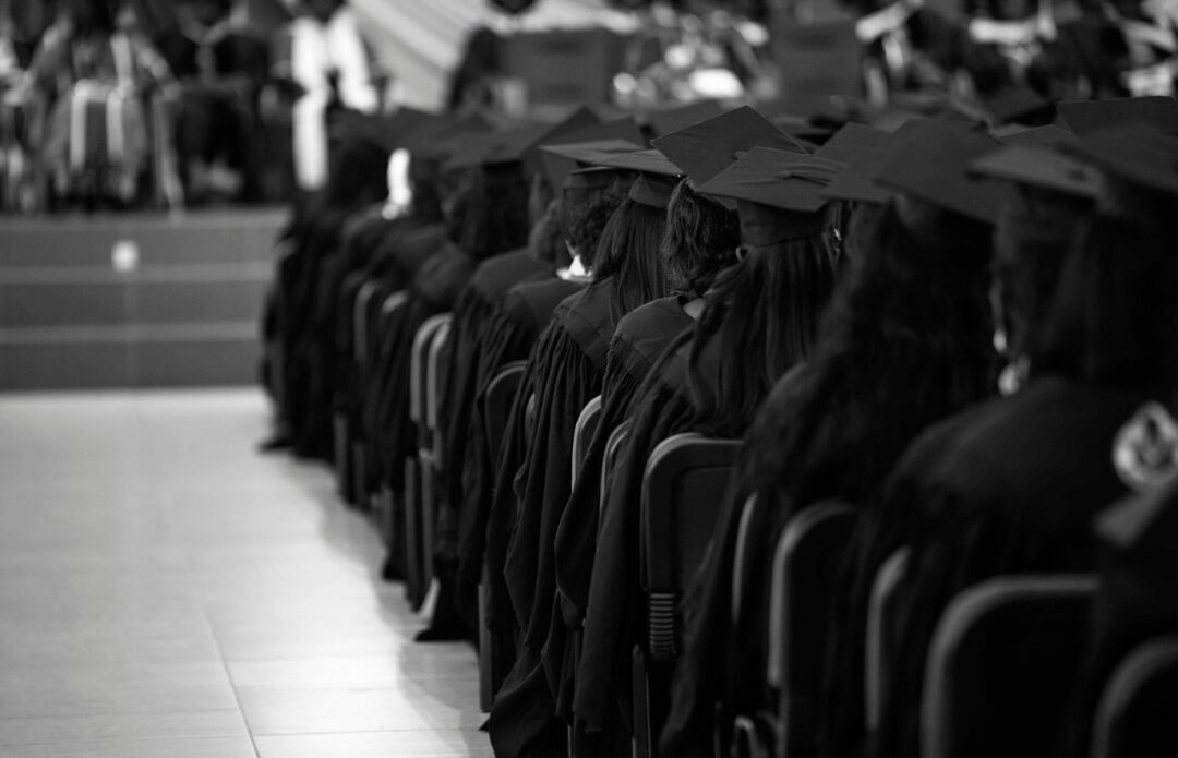 Graduates in caps and gowns at a commencement