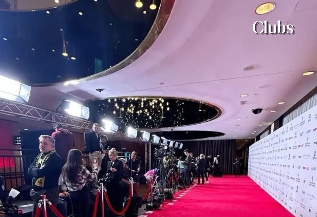 Photographers lining a red carpet