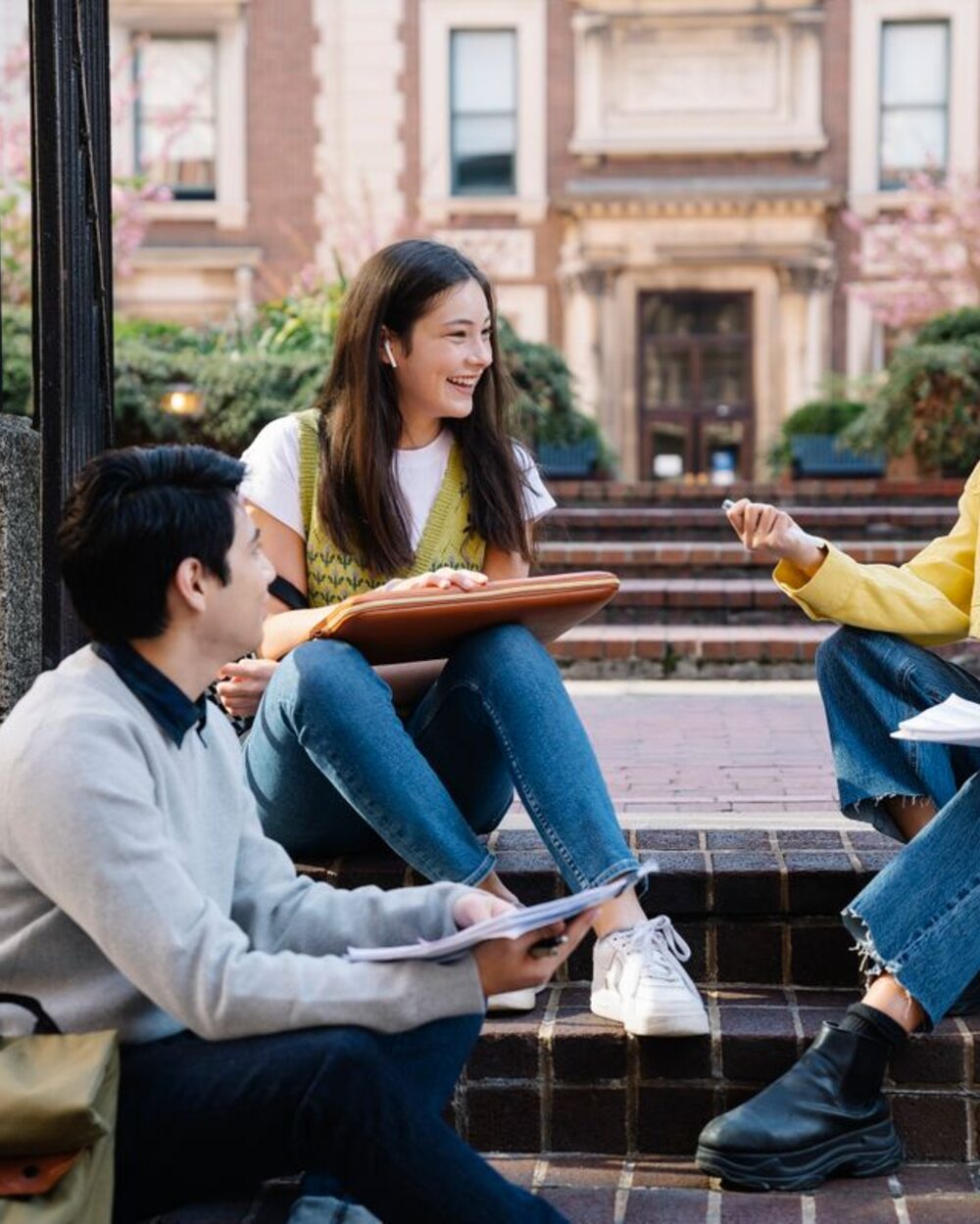 Students working together on campus steps